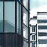 Stylized icon representing a modern office building